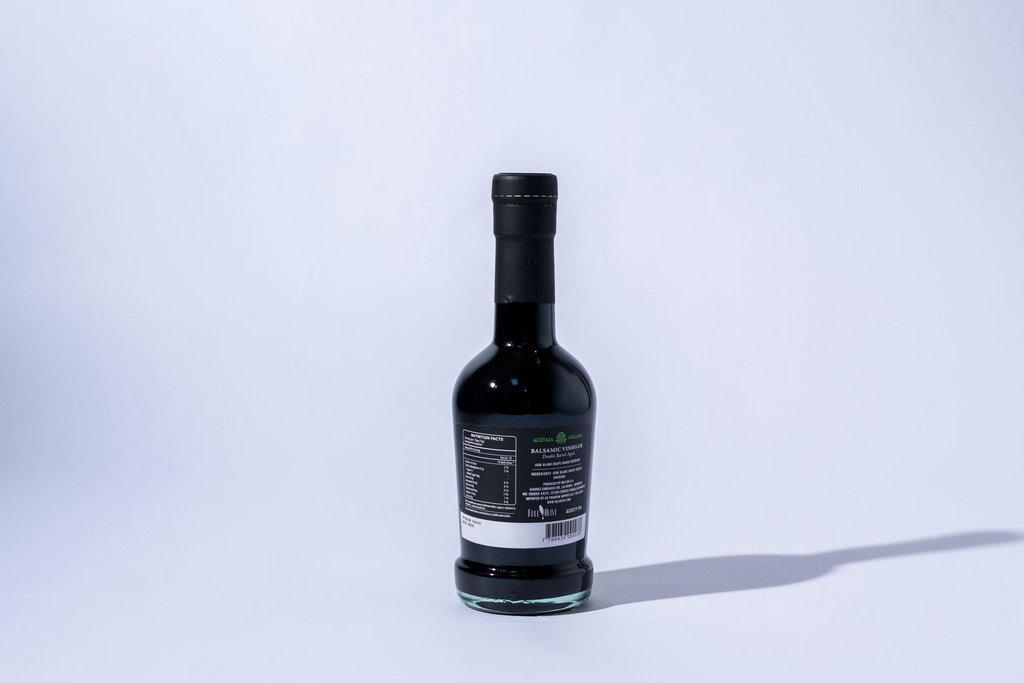 Bottle of double barrel balsamic  on a white background