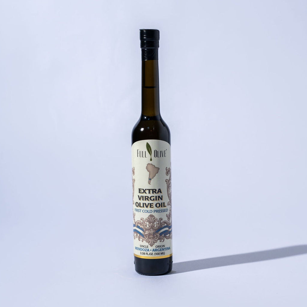 Bottle of extra virgin olive oil with a label on a white background