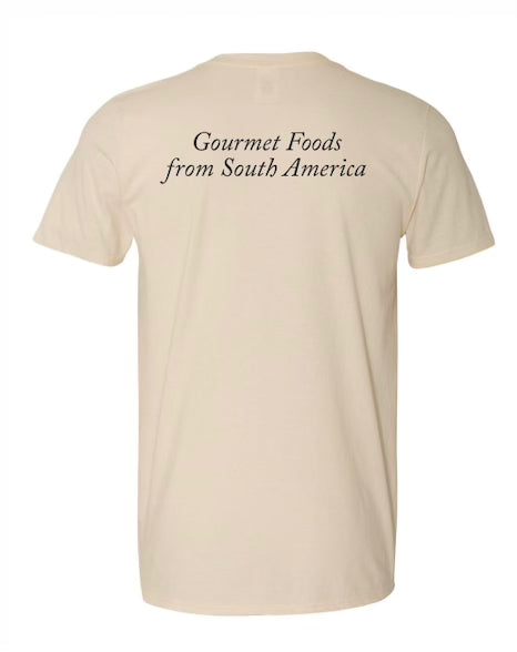 The backside of the short-sleeve t-shirt, featuring the phrase 'Gourmet Foods from South America' printed across it