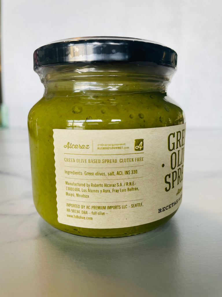 A jar of Green Olive Spread, featuring a label that highlights the ingredients