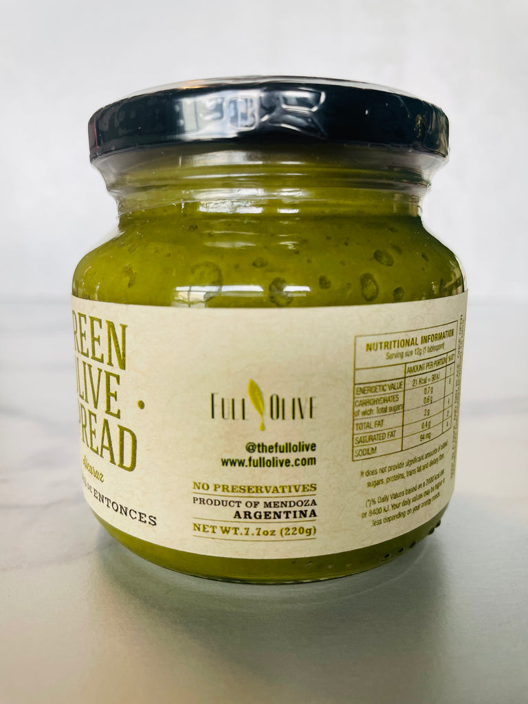 A jar of Green Olive Spread, with a label prominently displaying 'The Full Olive Company' and 'Product of Argentina,' emphasizing its origins and quality