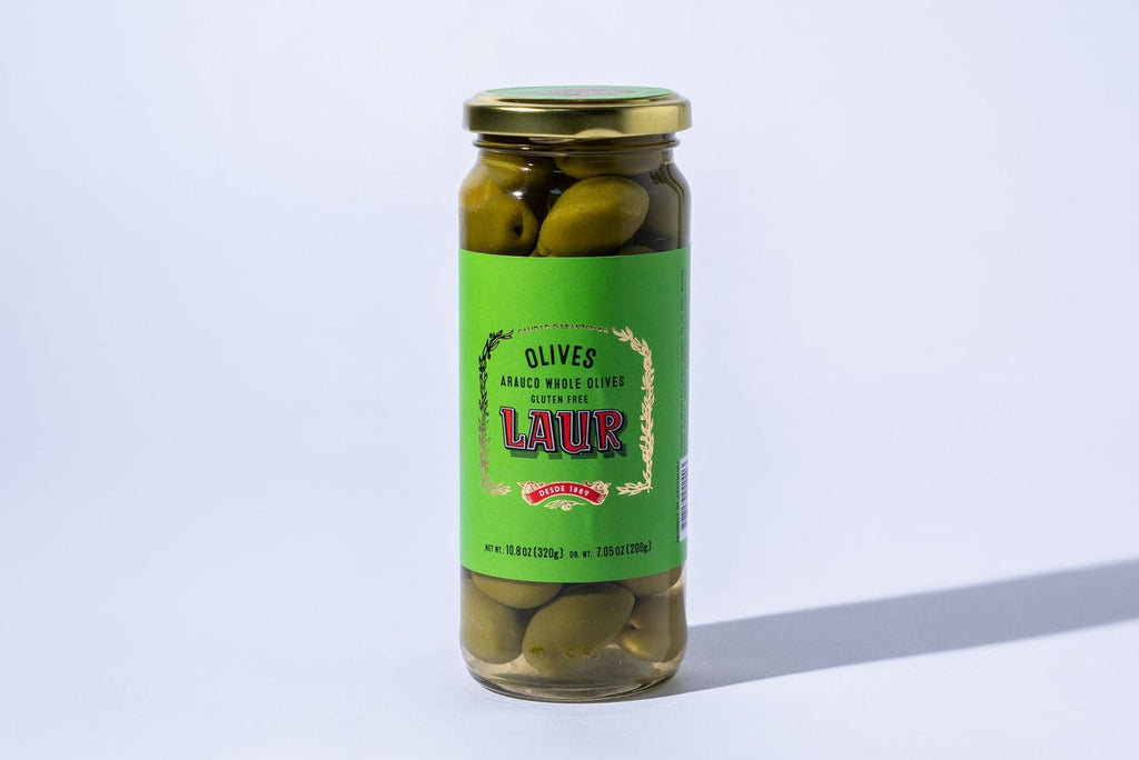 Jar of pickled olives with a green label on a white background