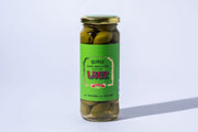Jar of pickled olives with a green label on a white background