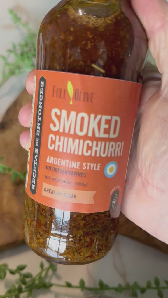 A video of Argentine Style Smoked Chimichurri sauce being poured over a cracker